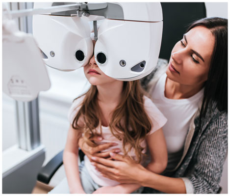 A mother and her daughter having a pediatric eye examination