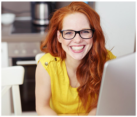 Red haired woman wearing her eyeglasses