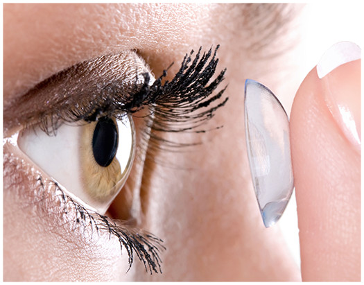Woman holding her contact lens
